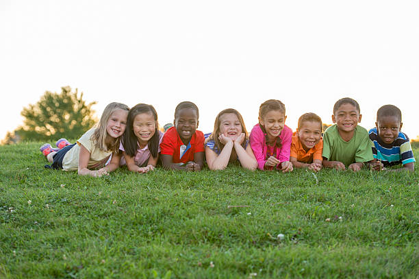 istock Children Relaxing Together at the Park 496859642
