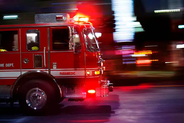 A fire engine races to the scene of an emergency.