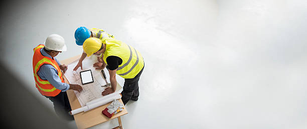 istock Group of engineers and architects supervising construction 496861104
