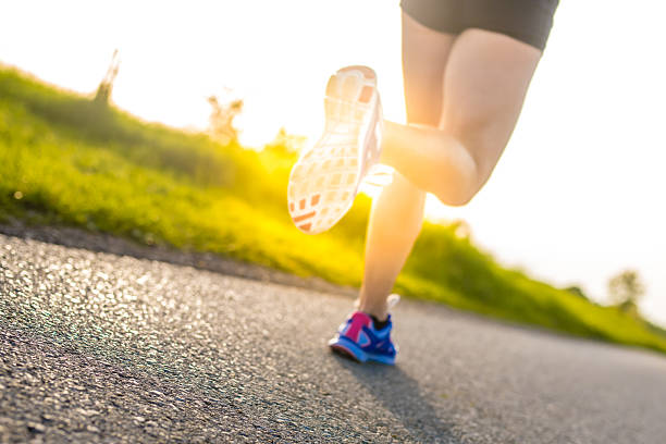 istock Woman jogging in park 496862720