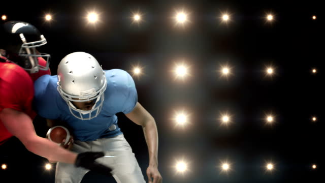 American football players against flashing lights