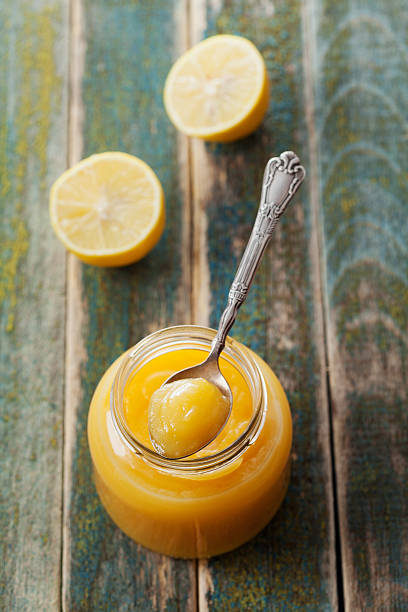 istock Lemon curd with lemons, traditional english fruit cream 496873328