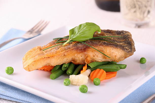 istock Fried carp fish fillet with vegetables 496874781