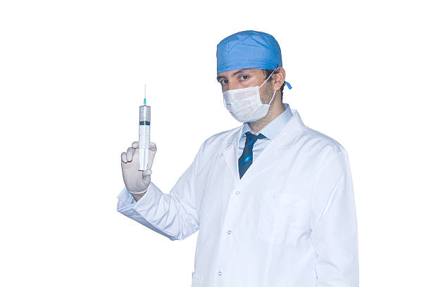 médico isolado com injecção - one person looking at camera male posing imagens e fotografias de stock