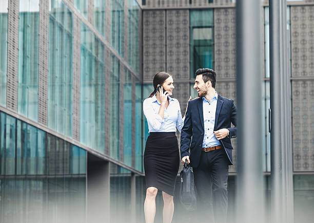 istock Business couple outdoors meeting 496876762