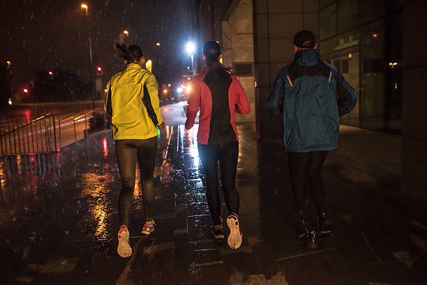 istock Man and women jogging in city 496878120
