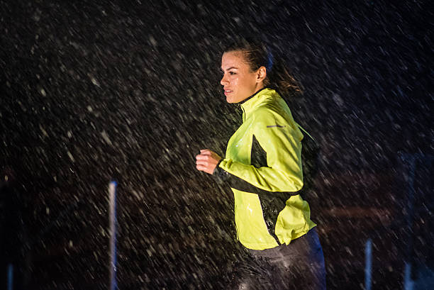 istock Woman running in rain 496878200