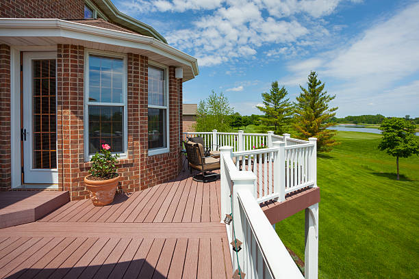 Stunning Home Deck With View of Golf Course Stunning Home Deck With View of Golf Course. This deck is make of high tech boards made from 100% recycled plastic. This image has a property release. house railing stock pictures, royalty-free photos & images
