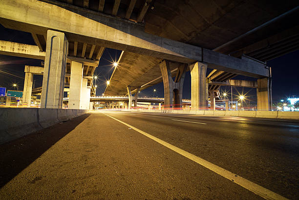 istock Light trails of fast moving vehicles 496878780