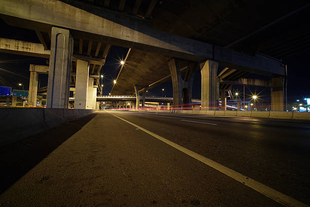 istock Light trails of fast moving vehicles 496878920