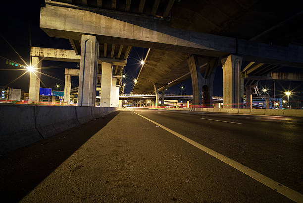 istock Light trails of fast moving vehicles 496879048