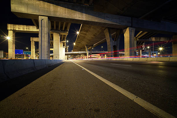 istock Light trails of fast moving vehicles 496879102