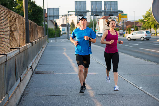 istock Man and woman jogging 496879112