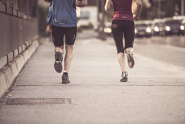 istock Man and woman jogging 496879324