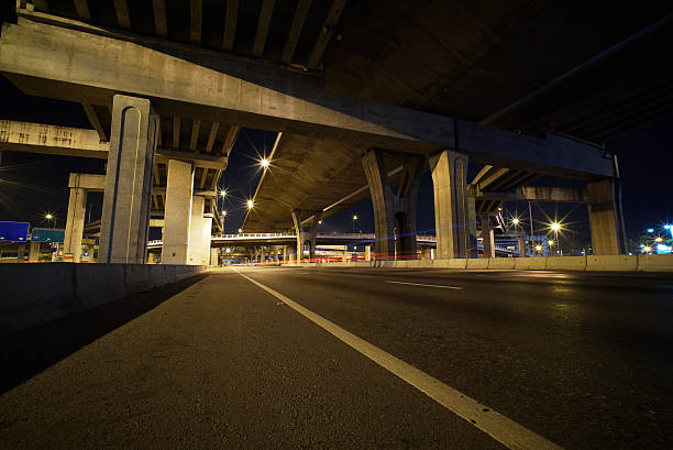 istock Light trails of fast moving vehicles 496879410