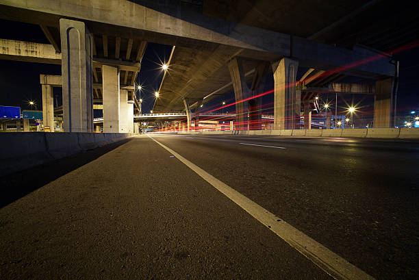 istock Light trails of fast moving vehicles 496879476