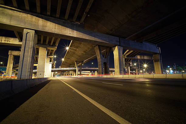 istock Light trails of fast moving vehicles 496879546