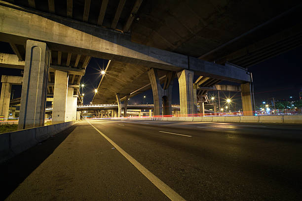 istock Light trails of fast moving vehicles 496879732
