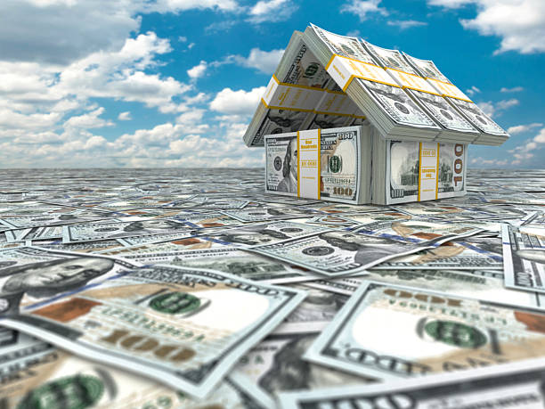 istock Bank. House from pack of dollars on cloudscape. 496880115