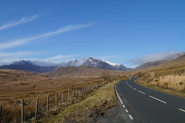 Mountain Road Beautiful mountain landscape of Snowdonia's highest peak (Wales, UK). snowdonia national park stock pictures, royalty-free photos & images