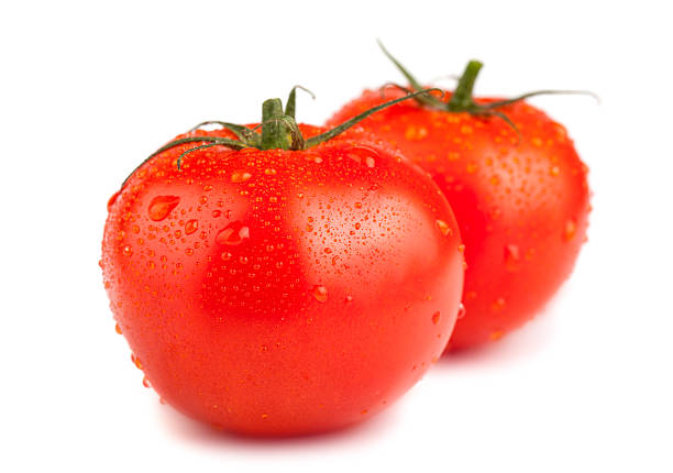 istock Two ripe red tomatoes with water drops 496881556