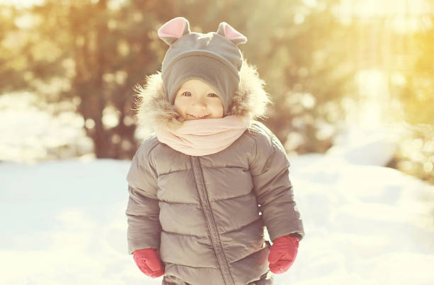 istock Happy smiling child walking in sunny warm winter day 496881842