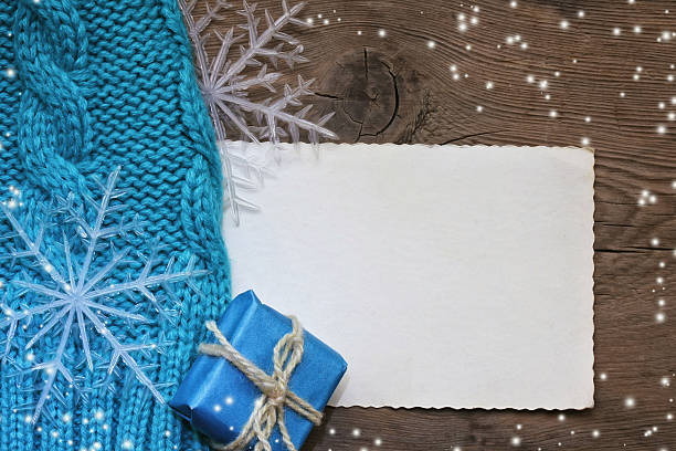 istock Christmas background with turquoise knitted hat 496884388