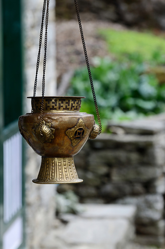 Old metal hanging incense-burner with swastika ornament , Asia,Himalayas,Nepal,everest region