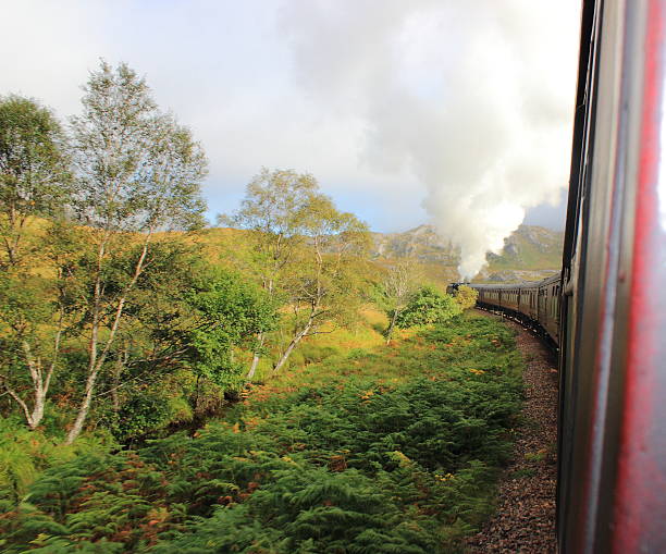 istock Steam Train Through The Mountains To Fort William 496888084