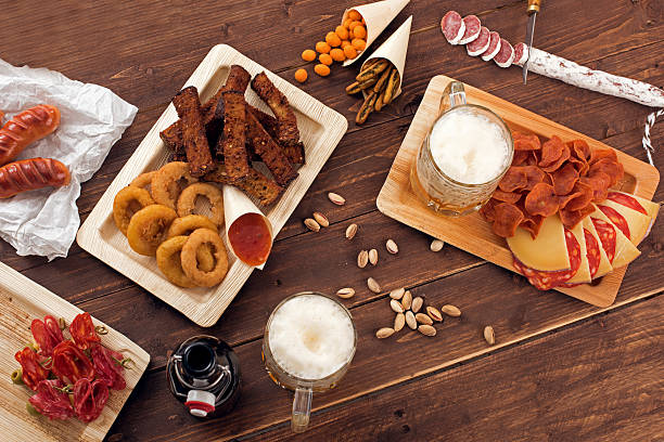 istock Mugs of beer with snacks 496888904
