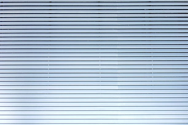 Grey blue metal / aluminium material background - horizontal lamellae
