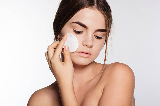 istock Pretty girl is holding cotton wool in hand 496916404