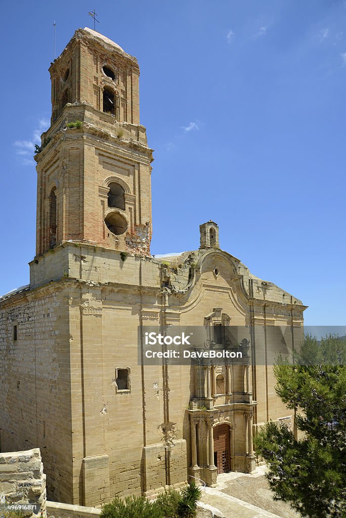 Church at Corbera d'Ebra, Catalonia The church, riddled with gun and shell shot, at Corbera d'Ebra in Catalonia, northern Spain. This whole small village is a major site relating to the Spanish Civil War and has been left in its post-war state as a monument to the war. Bell Tower - Tower Stock Photo