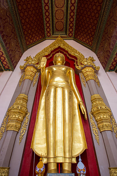 istock gold buddha temple in Thailand 496917209