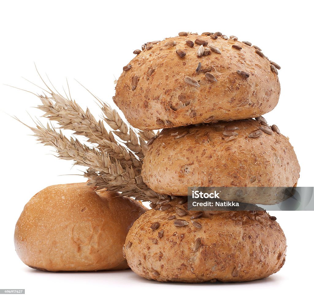 hamburger bun or roll  and wheat ears bunch   cutout hamburger bun or roll  and wheat ears bunch  isolated on white background cutout Arrangement Stock Photo