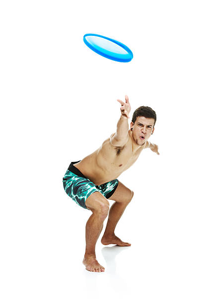 istock Shirtless man throwing frisbee 496917929