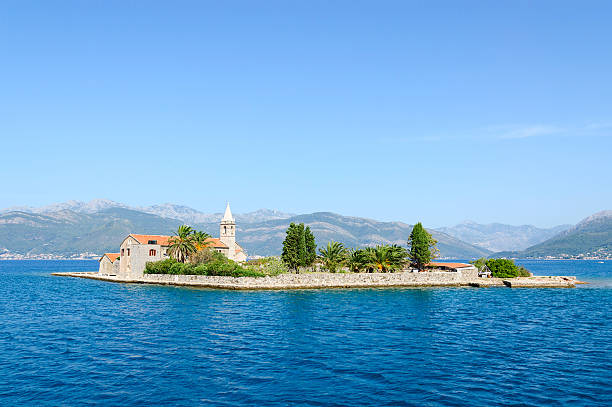 Otok Island (Gospa od Milo), Tivat Bay, Montenegro Otok Island (Gospa od Milo) with Jesuit monastery and church of the Blessed Virgin, Tivat Bay, Montenegro maria woerth stock pictures, royalty-free photos & images