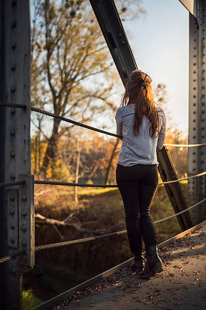 istock young women on a bridge 496919078