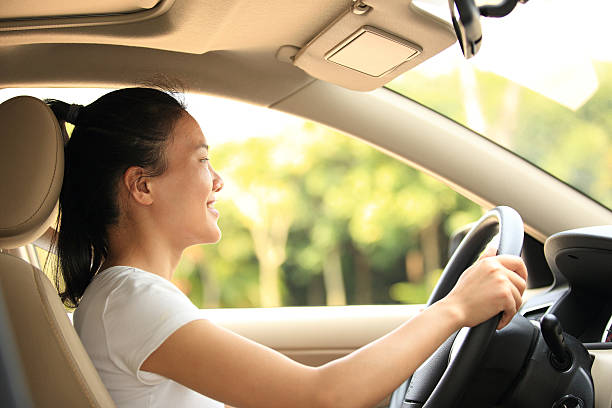 istock happy woman driver driving her car 496919595