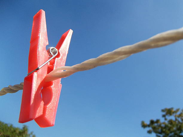 istock Pink Clothes Peg on a Washing Line 496919788