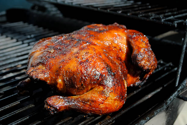 BBQ Chicken whole On my BBQ in my home cooked by me chicken bbq stock pictures, royalty-free photos & images