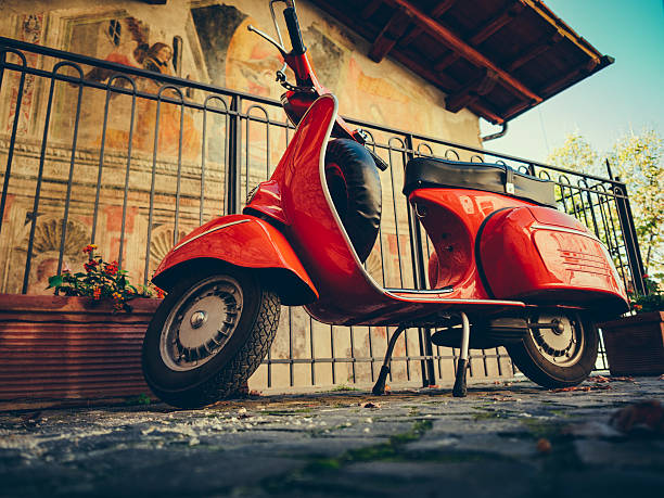 Vintage italian scooter on cobbled street Vintage italian scooter on cobbled street sermoneta stock pictures, royalty-free photos & images