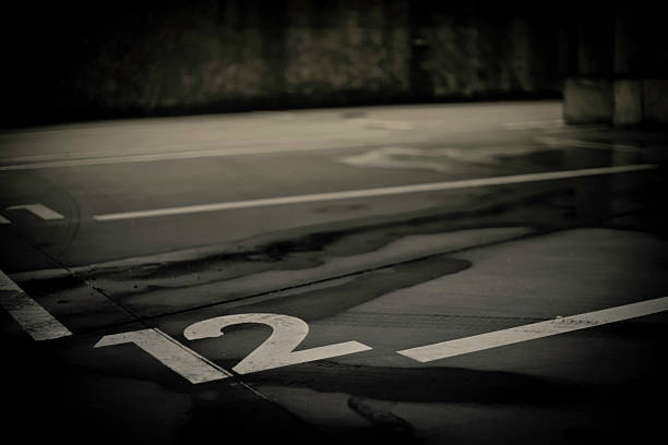 istock Empty parking lot with white lines and numbers 496922340