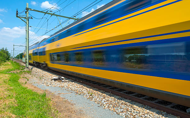 istock Train riding through the countryside in spring 496922907