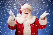 Santa Claus happy that it is snowing