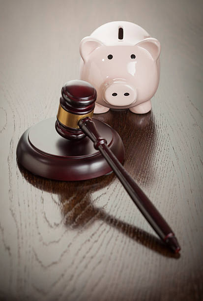 istock Gavel and Piggy Bank on Table 496923219