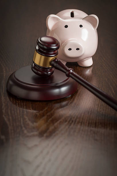 istock Gavel and Piggy Bank on Table 496923221