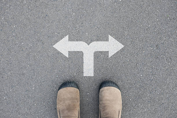 istock Shoes standing at the crossroad 496923530