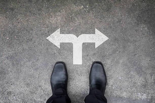 istock Black shoes standing at the crossroad 496923628