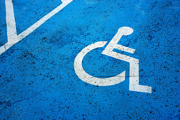 istock wheel chair sign parking spot 496923928